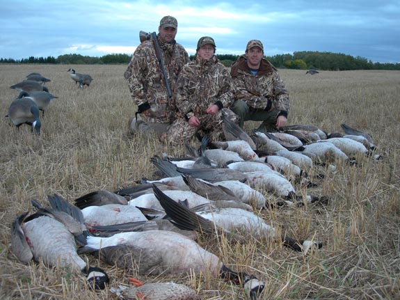 Alberta waterfowl hunters pose with their geese following a guided Venture North Outfitting hunt.